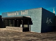 A commercial building in Oak Park Michigan with a flat roof and brown awning.