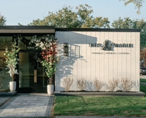 A commercial building in Oak Park Michigan with a flat roof and brown awning.
