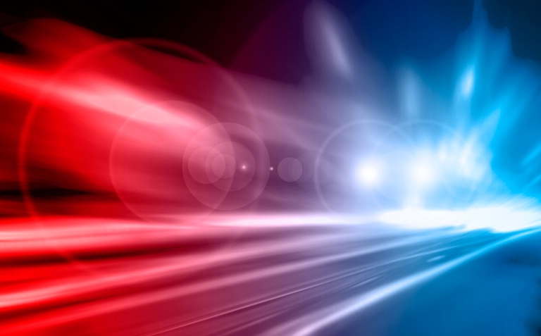Bright red and blue lights flare out simulating a police car light bar.