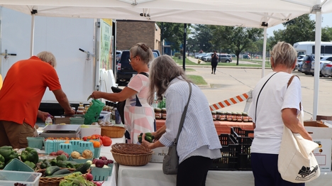Shoppers browse through the Farmers Market in Oak Park, Michigan.