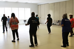 A group of seniors practice dance moves in the Community Center in Oak Park Michigan.